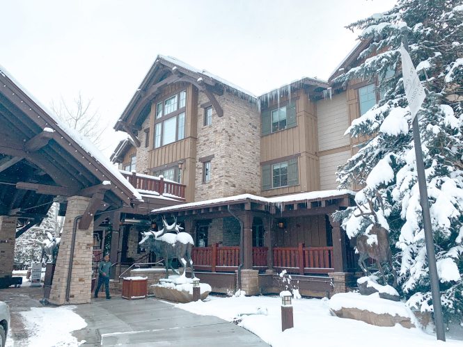 front if Hotel Park City in the snow